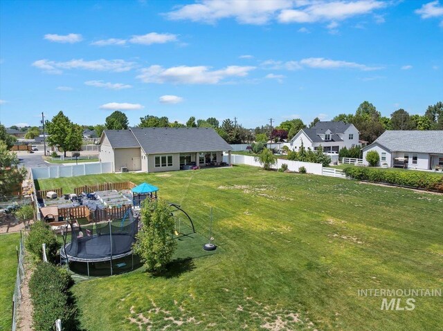 14942 Midway Rd, Nampa, ID 83651 - view of yard featuring a trampoline and a residential view