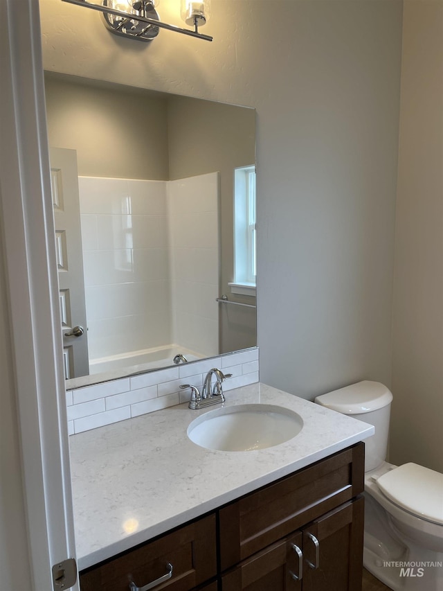 full bathroom featuring vanity and toilet