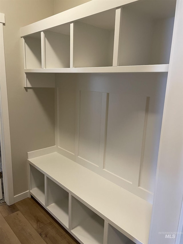 mudroom with dark wood-style floors