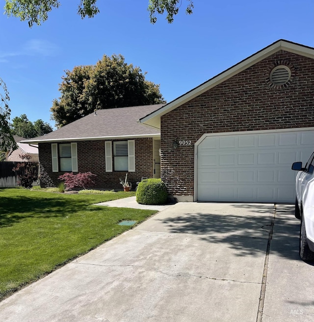 9052 W Donnybrook Ct, Boise, ID 83709 - single story home featuring brick siding, driveway, an attached garage, a front yard, and roof with shingles
