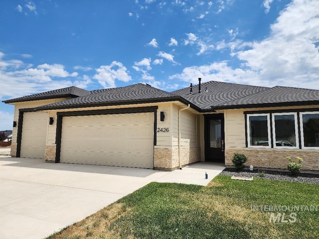 2426 S Hurd Ave, Nampa, ID 83686 - ranch-style house featuring a garage, concrete driveway, and a front yard