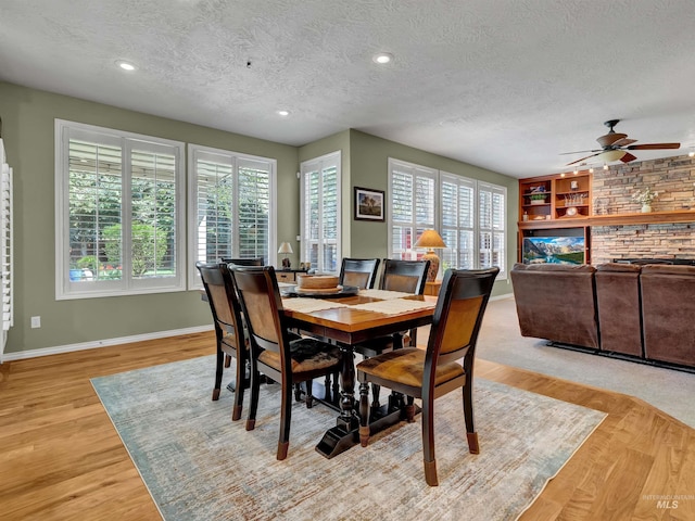 1546 N Dragonfly Ct, Eagle, ID 83616 - dining area with a textured ceiling, baseboards, light wood-type flooring, recessed lighting, and a ceiling fan