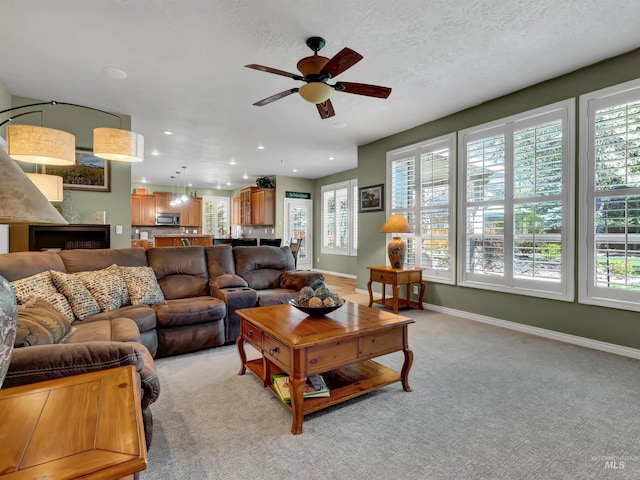 1546 N Dragonfly Ct, Eagle, ID 83616 - living room with recessed lighting, light carpet, ceiling fan, and plenty of natural light