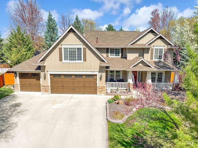 1546 N Dragonfly Ct, Eagle, ID 83616 - craftsman house featuring driveway, board and batten siding, and a porch