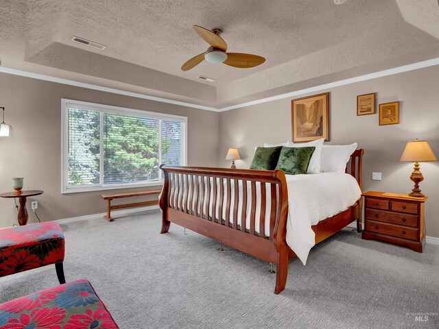 1546 N Dragonfly Ct, Eagle, ID 83616 - bedroom with carpet flooring, a textured ceiling, visible vents, and a tray ceiling