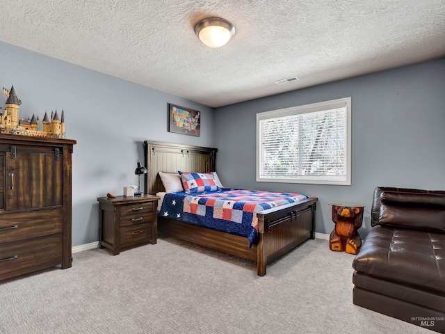 1546 N Dragonfly Ct, Eagle, ID 83616 - bedroom featuring a textured ceiling, visible vents, light colored carpet, and baseboards