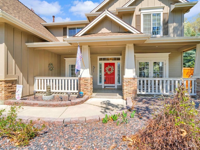 1546 N Dragonfly Ct, Eagle, ID 83616 - entrance to property featuring covered porch, board and batten siding, stone siding, and roof with shingles