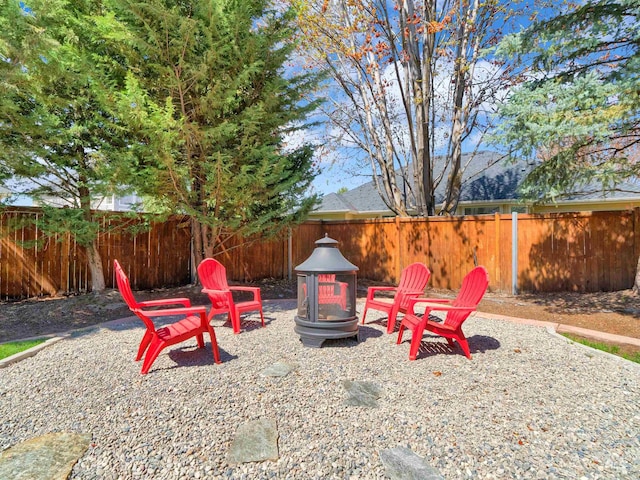 1546 N Dragonfly Ct, Eagle, ID 83616 - view of yard featuring an outdoor fire pit and a fenced backyard