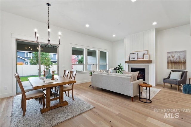11270 S Saylis Way, Kuna, ID 83634 - dining space with a chandelier, light wood-type flooring, a fireplace, and recessed lighting