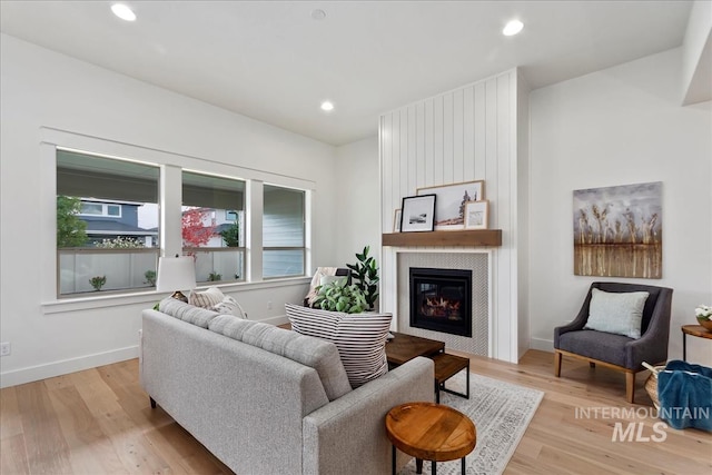 11270 S Saylis Way, Kuna, ID 83634 - living room with a fireplace, light wood finished floors, and recessed lighting
