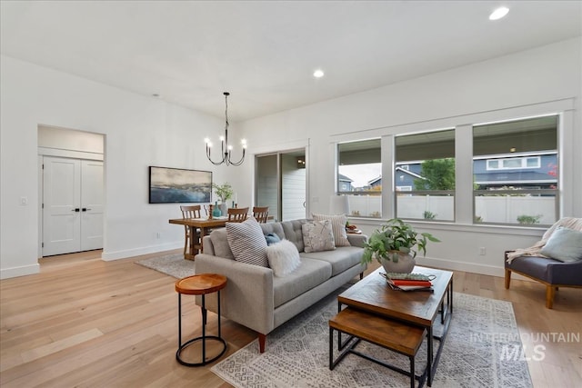 11270 S Saylis Way, Kuna, ID 83634 - living area featuring a chandelier, light wood-style flooring, and recessed lighting