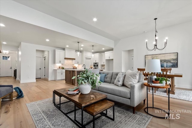 11270 S Saylis Way, Kuna, ID 83634 - living room with a chandelier, light wood-style floors, and recessed lighting