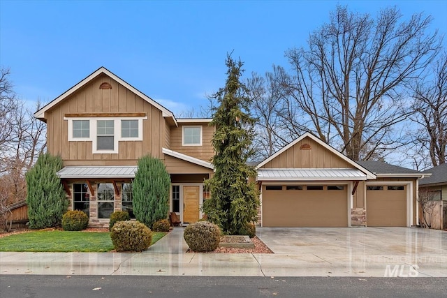 craftsman-style home featuring a garage and a front yard