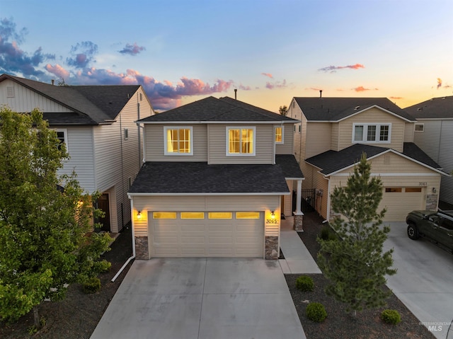 3065 E Ionia Ct, Meridian, ID 83642 - view of front of property with concrete driveway, stone siding, roof with shingles, and an attached garage