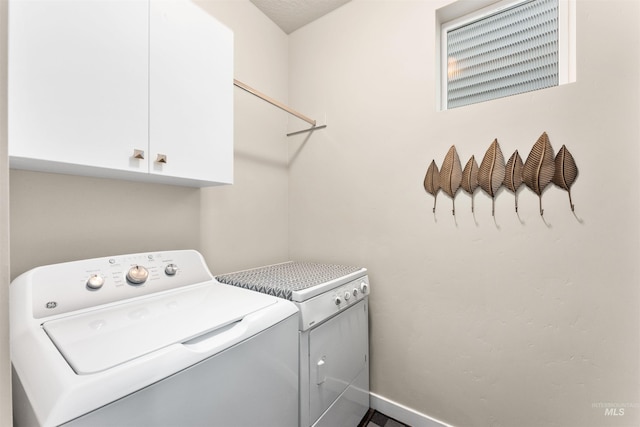 3065 E Ionia Ct, Meridian, ID 83642 - laundry room with cabinet space, washer and clothes dryer, and baseboards