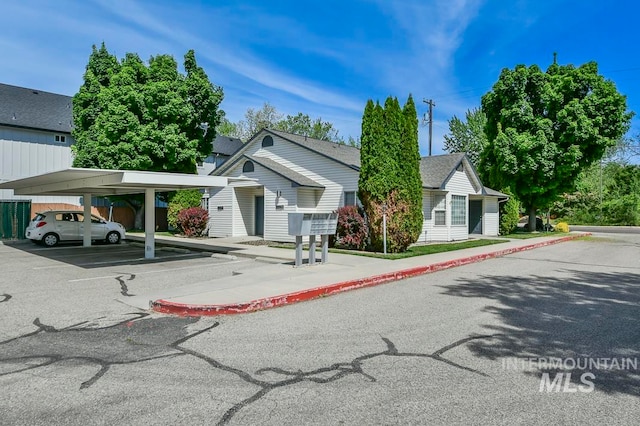 view of front of home featuring a carport