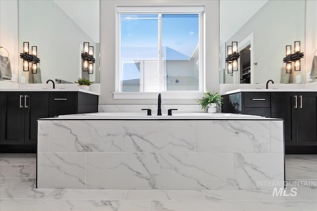 bar with marble finish floor and a sink