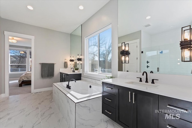 full bath featuring recessed lighting, a sink, marble finish floor, a bath, and a stall shower