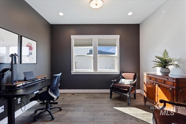 office featuring baseboards, wood finished floors, and recessed lighting
