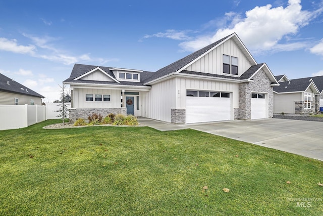 2877 Evening Sun, Twin Falls, ID 83301 - view of front of property with fence, concrete driveway, board and batten siding, stone siding, and a front yard