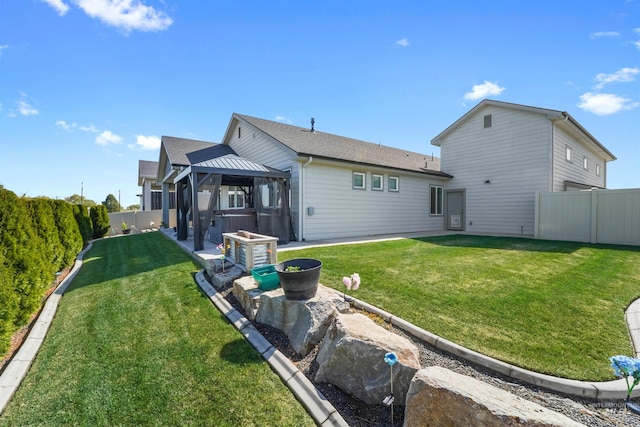 3056 E Columbus River Ct, Nampa, ID 83686 - back of house featuring a gazebo, a fenced backyard, a lawn, and a patio