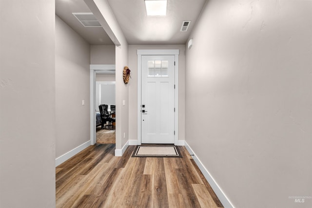 3056 E Columbus River Ct, Nampa, ID 83686 - doorway featuring baseboards, visible vents, and wood finished floors