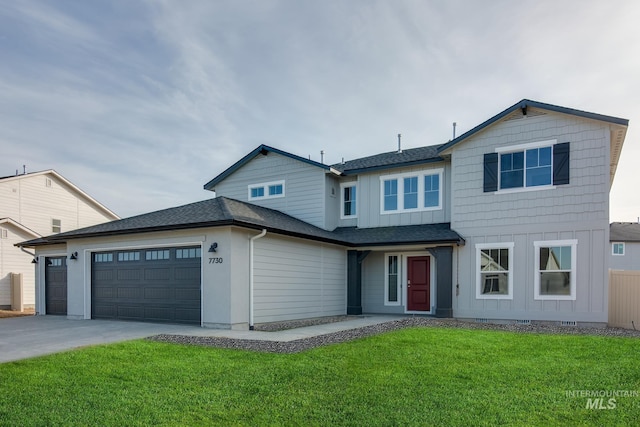 view of front of home featuring a front lawn, board and batten siding, roof with shingles, concrete driveway, and a garage