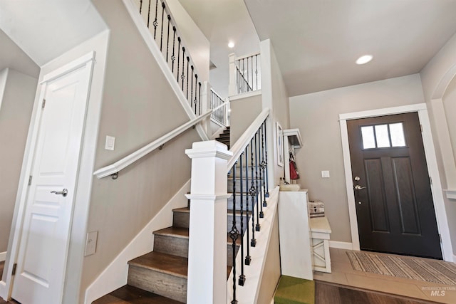 entryway with hardwood / wood-style floors