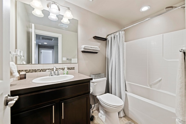 full bathroom featuring backsplash, toilet, shower / bath combo with shower curtain, vanity, and tile patterned floors