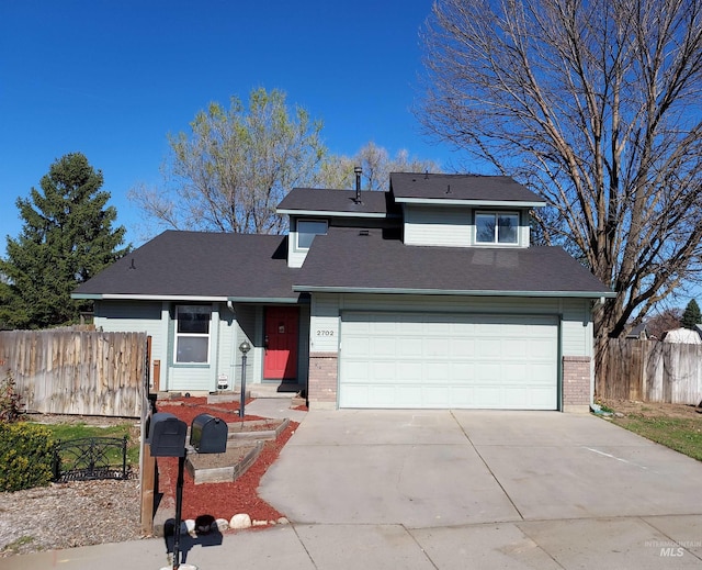 2702 N Camden Pl, Boise, ID 83704 - view of front of house with fence, an attached garage, driveway, and brick siding