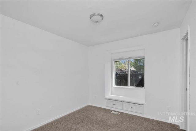 2702 N Camden Pl, Boise, ID 83704 - carpeted empty room featuring visible vents and baseboards