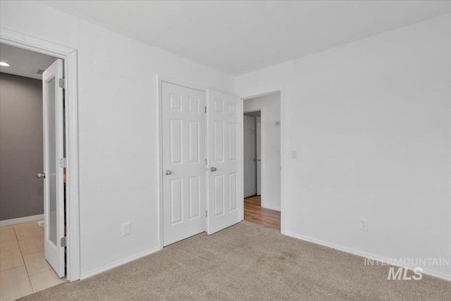 2702 N Camden Pl, Boise, ID 83704 - unfurnished bedroom with baseboards and light colored carpet