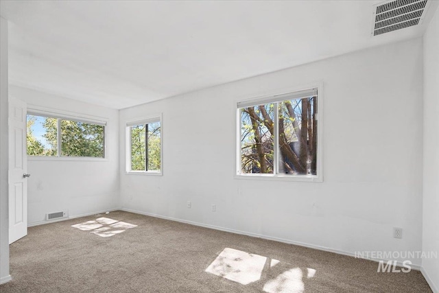 2702 N Camden Pl, Boise, ID 83704 - carpeted empty room with visible vents and baseboards