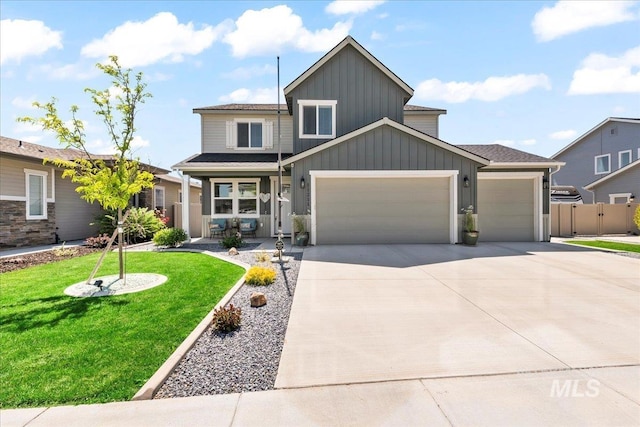 11211 Sopris Loop, Caldwell, ID 83605 - traditional-style home with board and batten siding, an attached garage, and concrete driveway