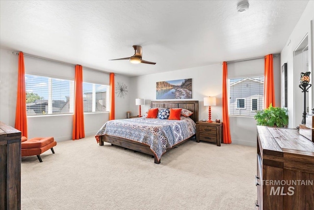 11211 Sopris Loop, Caldwell, ID 83605 - bedroom featuring carpet flooring, ceiling fan, and baseboards