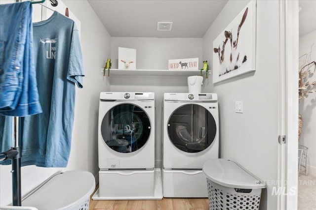 11211 Sopris Loop, Caldwell, ID 83605 - laundry room with independent washer and dryer and light wood-type flooring