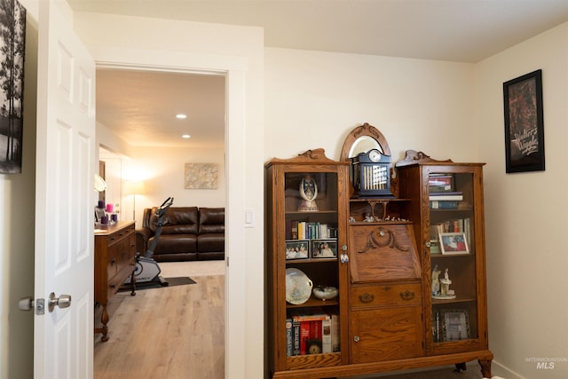 hall with hardwood / wood-style floors