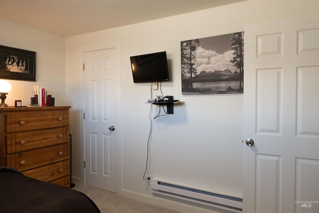 bedroom featuring carpet floors and baseboard heating