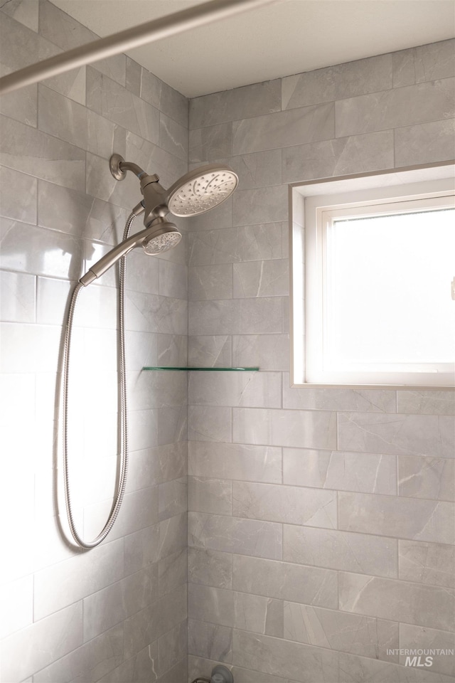 bathroom with a tile shower