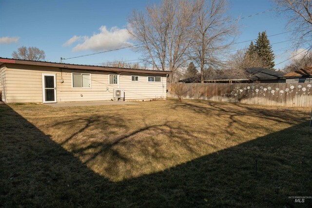 back of house featuring a yard