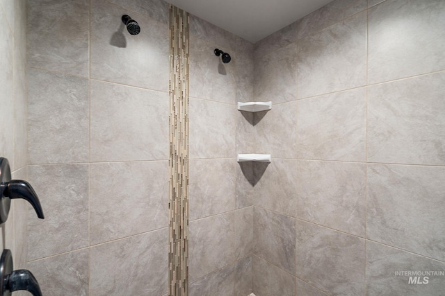 details with a tile shower