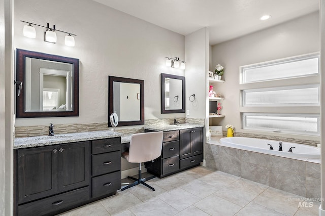 bathroom featuring a bath, vanity, and tile patterned floors