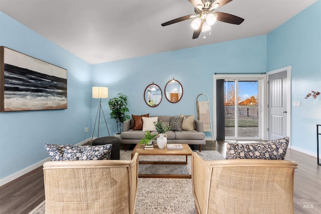 living room featuring ceiling fan, hardwood / wood-style floors, and lofted ceiling