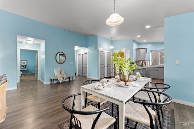 dining area featuring dark hardwood / wood-style floors