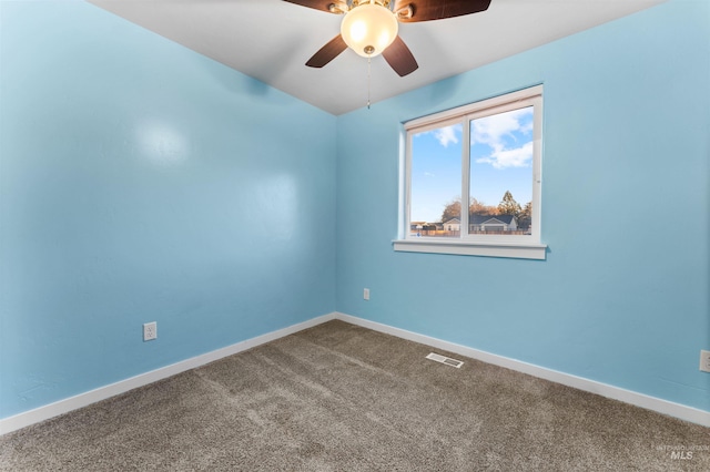 empty room with ceiling fan and carpet