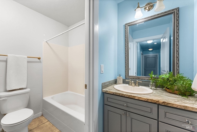 full bathroom featuring tub / shower combination, toilet, tile patterned floors, and vanity