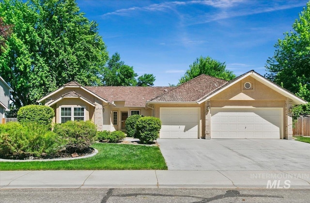 900 N Player Ave, Eagle, ID 83616 - ranch-style home with a garage, concrete driveway, brick siding, a front yard, and stucco siding