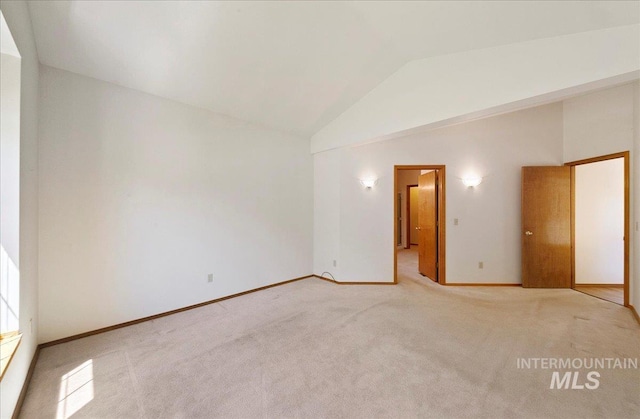 900 N Player Ave, Eagle, ID 83616 - spare room with lofted ceiling, light colored carpet, and baseboards