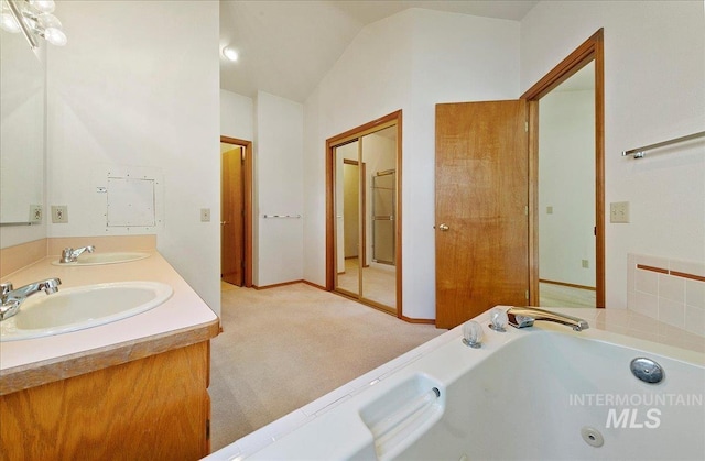 900 N Player Ave, Eagle, ID 83616 - full bathroom featuring double vanity, a jetted tub, and lofted ceiling