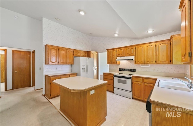 900 N Player Ave, Eagle, ID 83616 - kitchen featuring white appliances, extractor fan, a sink, wallpapered walls, and a kitchen island